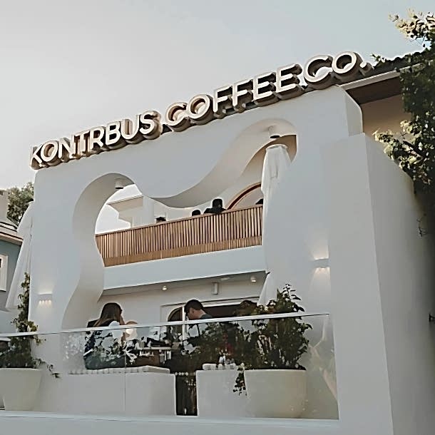 Barista Pours Water From Coffee Pot